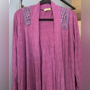 Open Women's jacket burgandy color, mid length, long sleeves, and light piece.